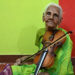 in-a-village-of-silence,-her-violin-continues-to-sing-for-80-years