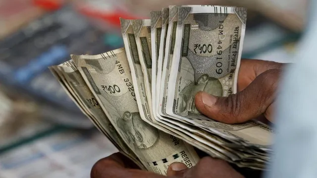 Rupee falls 13 paise to close at 87.71 against US dollar