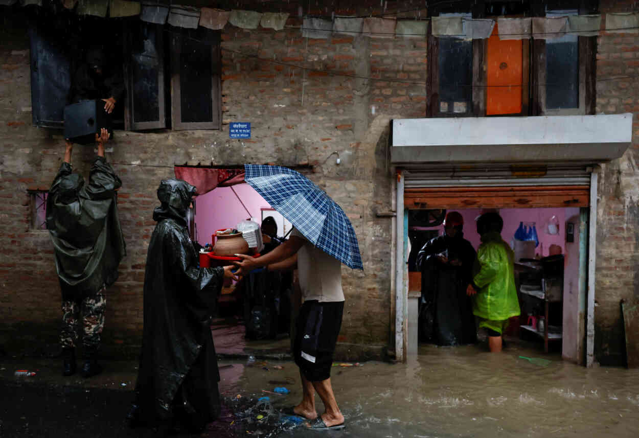 Heavy rains kill at least 22 in Nepal, block roads | Reuters