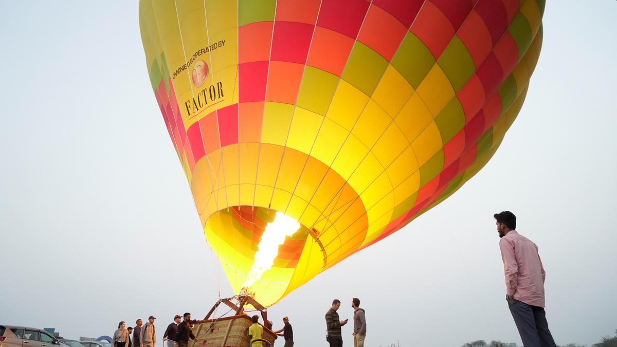 At dawn over Hyderabad, two hot air balloons drift to shape citys tourism plans