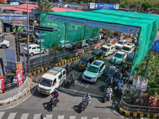 summer-relief-for-commuters,-gvmc-sets-up-green-shade-at-rtc-complex-junction